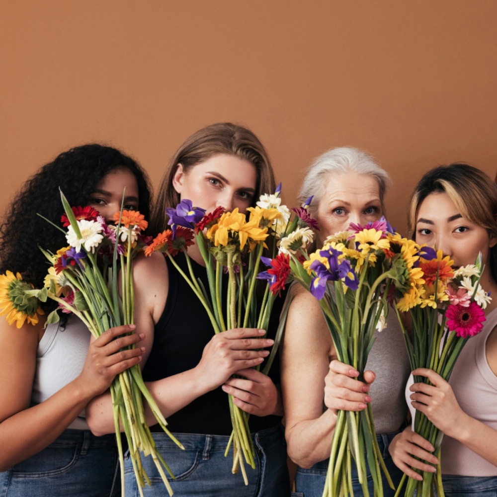 Women with flowers of different age groups and ethnicities representing women's health check packages.
